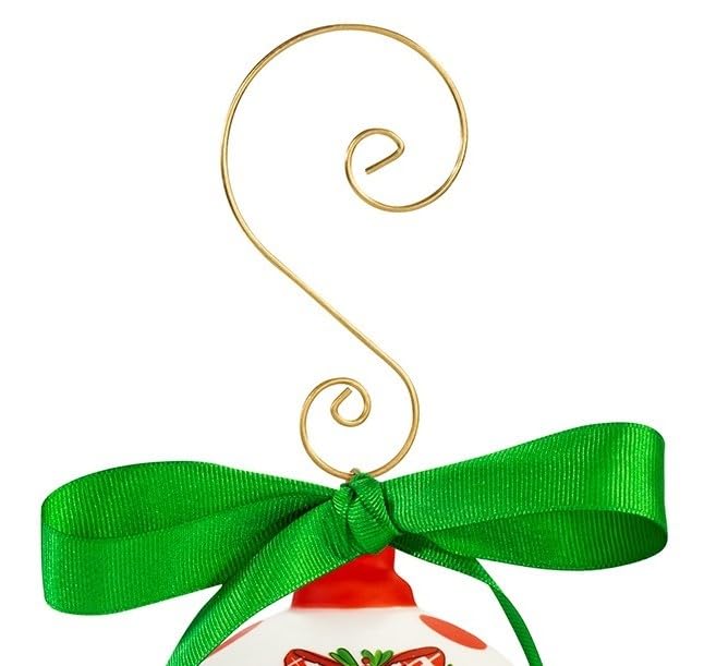 A swirly gold metal ornament hanger