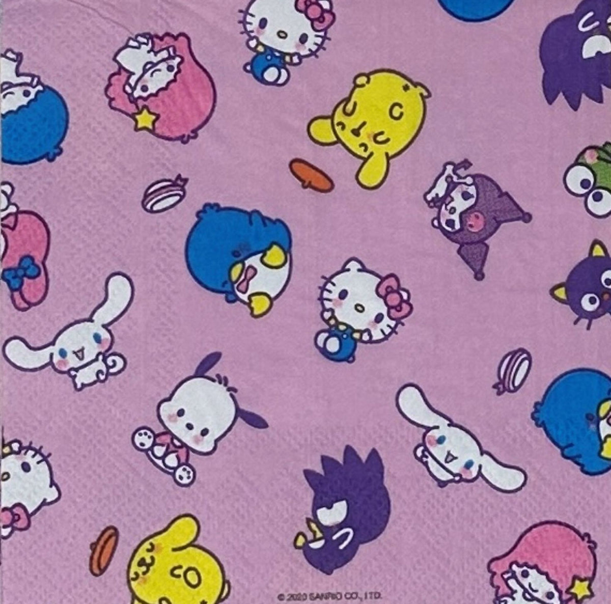 Cocktail size decoupage paper napkin featuring the Sanrio character family including Hello Kitty Cinnamoroll My Melody Pompompurin and Badtz-Maru scattered across a sweet lavender pink background set of 2