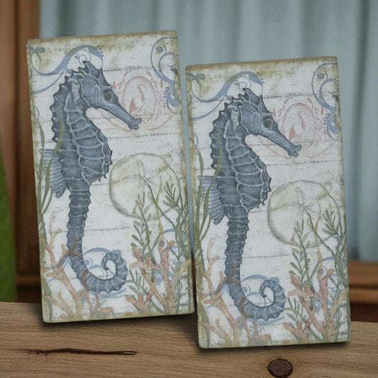 Seahorse cocktail size decoupage napkin with coastal nautical seahorse design displayed