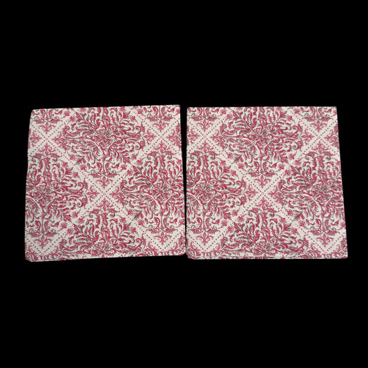 Two pink and white damask-style decoupage napkin with an ornate floral scroll pattern arranged in a repeating diamond design on a cream background.