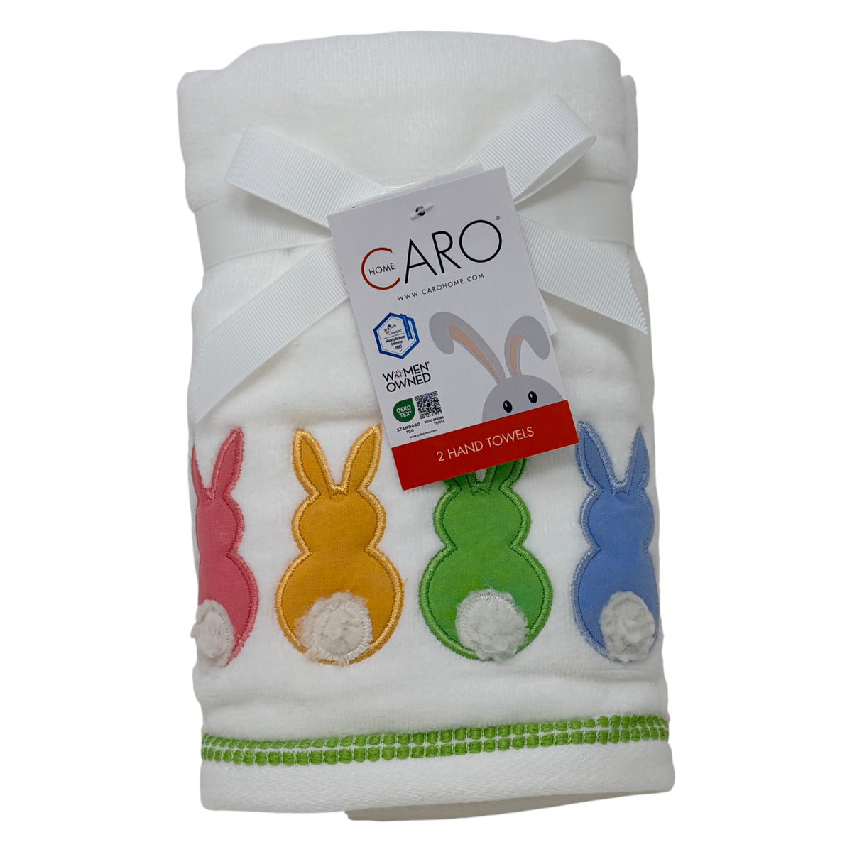Set of two white cotton hand towels featuring colorful bunny appliqués with pom‑pom tails by Caro Home