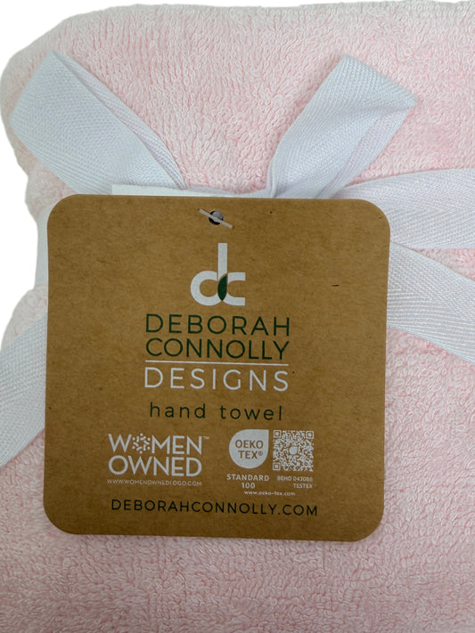 Set of two light‑pink hand towels with white embroidered swans by Deborah Connolly Designs, cotton‑lyocell blend