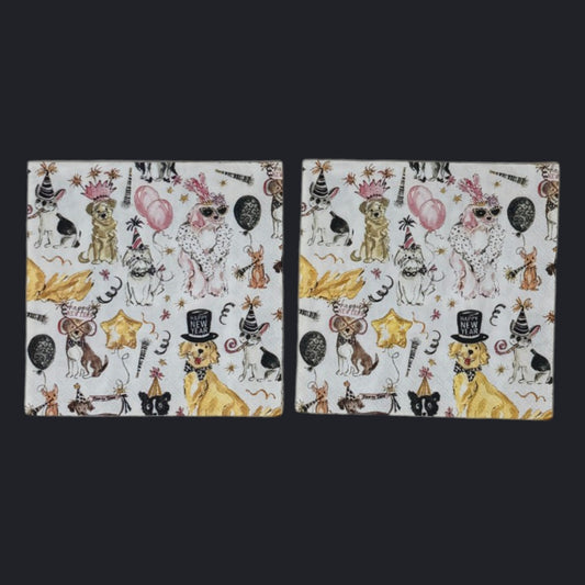 Cocktail-size decoupage paper napkin featuring an all-over watercolor illustration of dressed-up dogs in party hats, crowns, and top hats celebrating New Year's with pink and black balloons, gold star balloons, streamers, and Happy New Year banners on a white background.