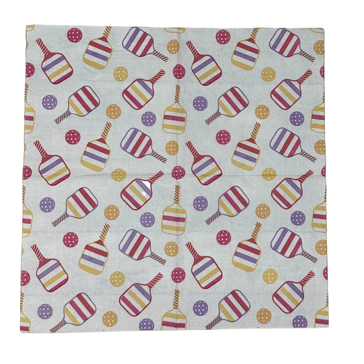 open paper napkin featuring colorful pickleball paddles and balls