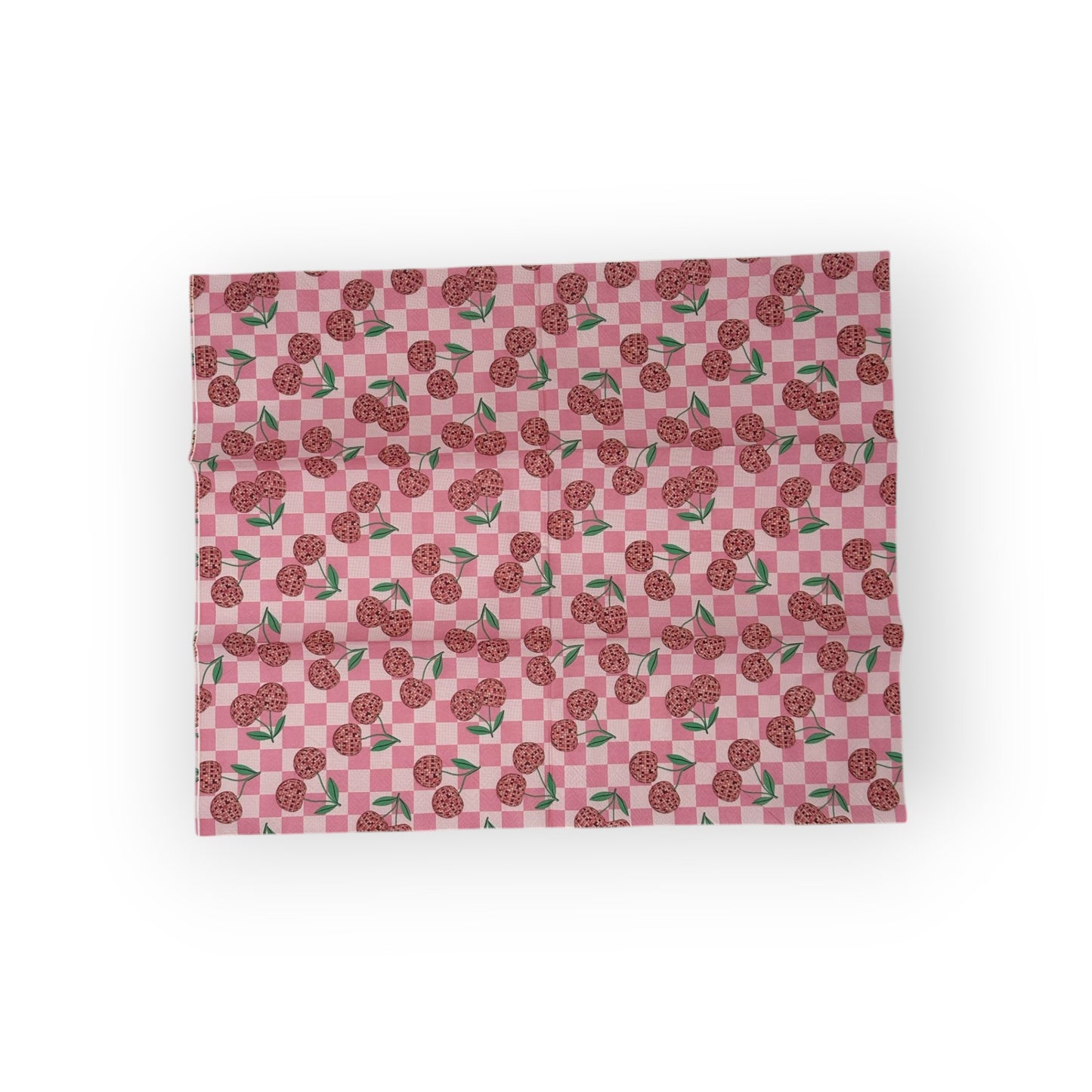 Pink gingham cocktail napkin featuring disco‑ball cherries with green stems in retro pop style