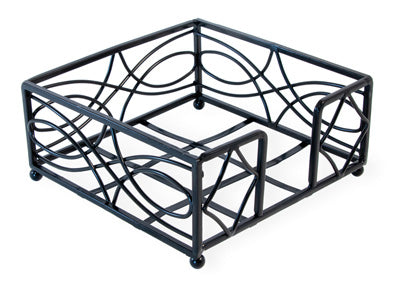 A black metal cocktail napkin holder with a wave design and ball feet.