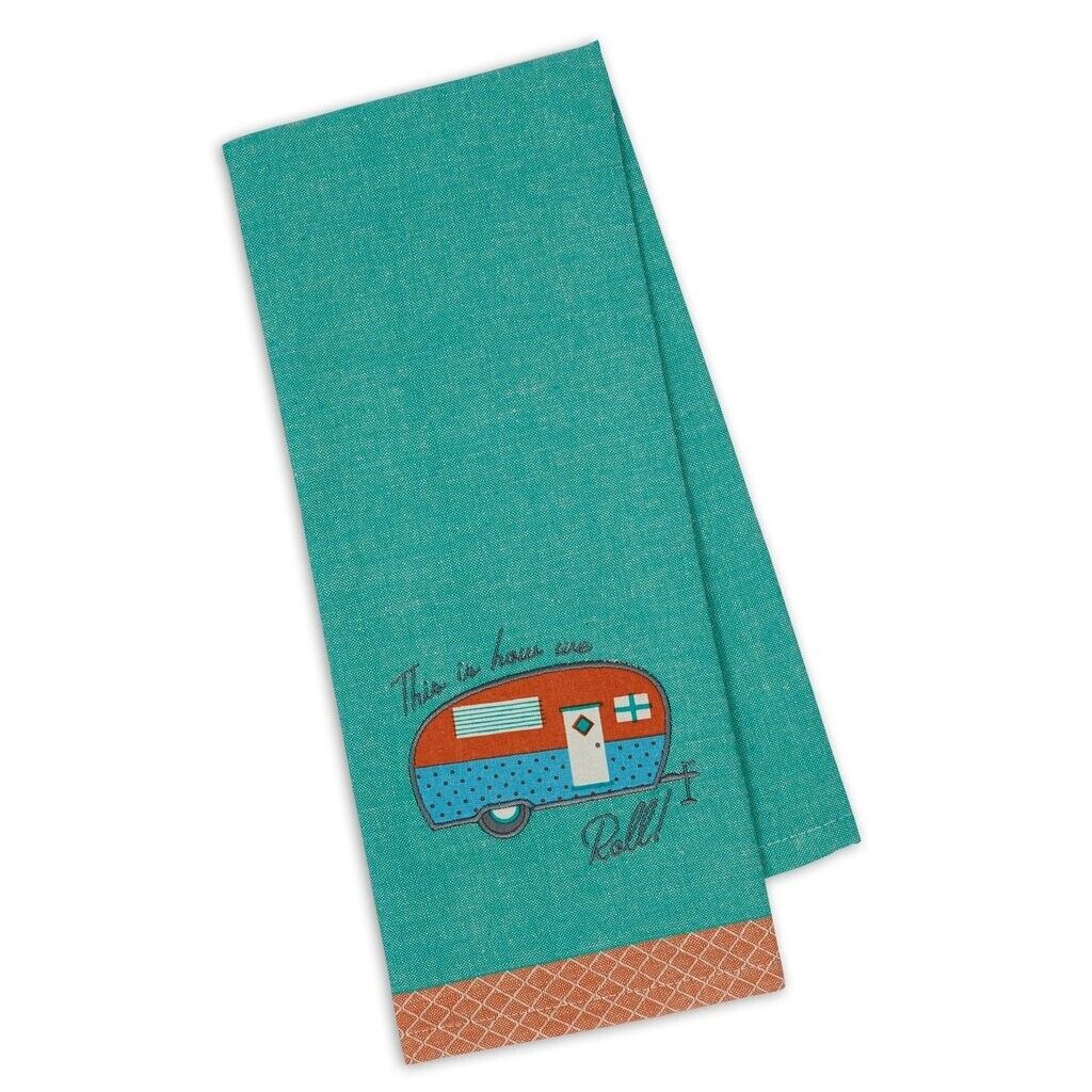 A blue kitchen towel with an embroidered retro camper and the text 'This Is How We Roll' on it, displayed on a neutral background.