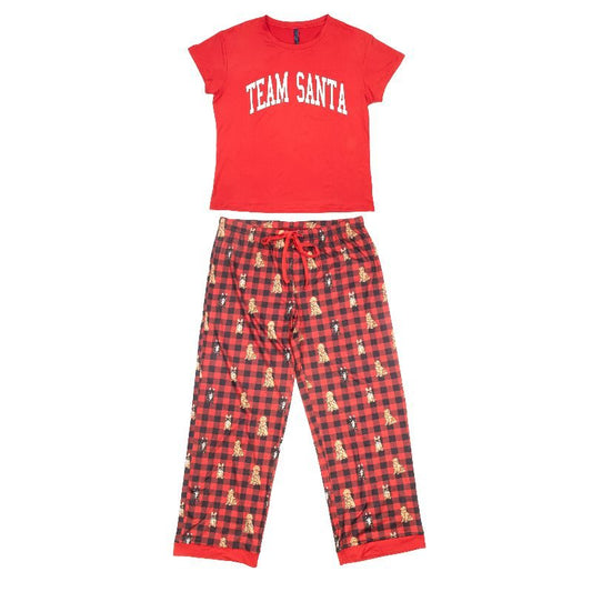A two-piece kids' pajama set featuring a red short-sleeve t-shirt with 'TEAM SANTA' printed in white arched letters, and matching red and black buffalo plaid pants decorated with small Santa Claus silhouettes, shown on a plain white background.