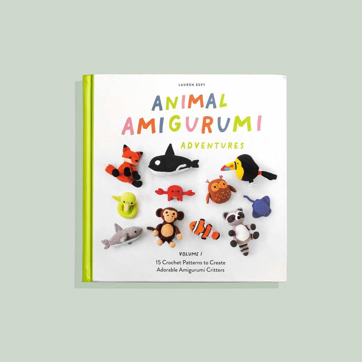 Book titled 'Animal Amigurumi Adventures' with illustrations of amigurumi animals on a light gray background