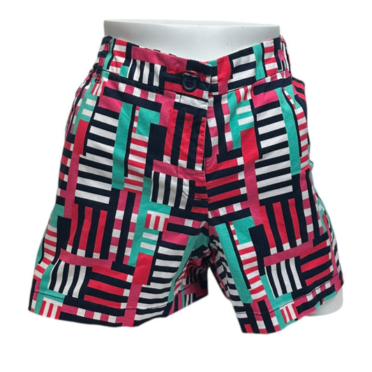 Colorful geometric patterned shorts on a white background