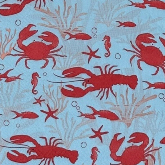 Paper napkin with red lobster and crab pattern on blue background