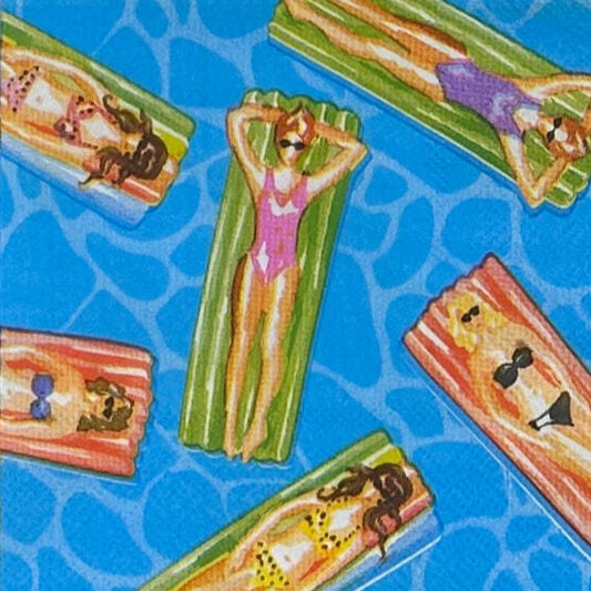 Paper napkin with women in bathing suits realaxing on floats in a pool.