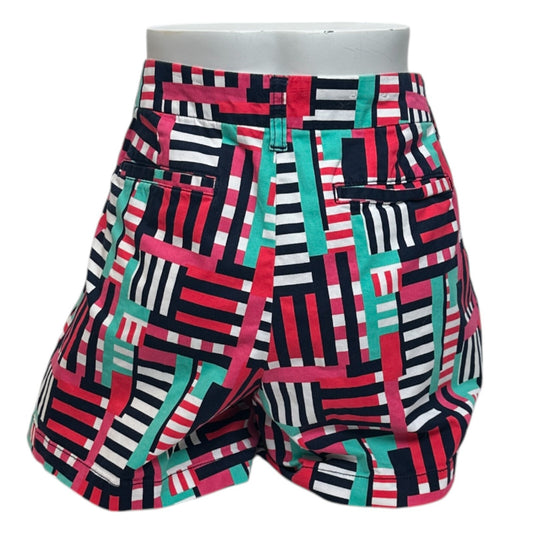 Colorful geometric patterned shorts on a white background