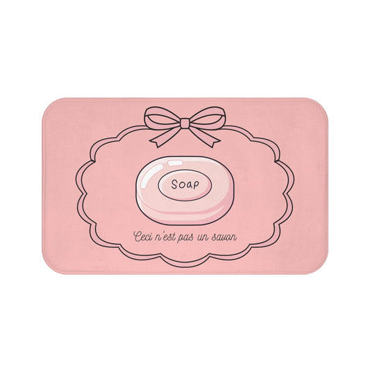 Pink soap dish with a bow and 'Soap' text on a white background