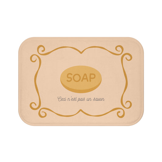 René Magritte 'Ceci n'est pas un savon' Bath Mat, Light ORANGE  | Artistic Bathroom