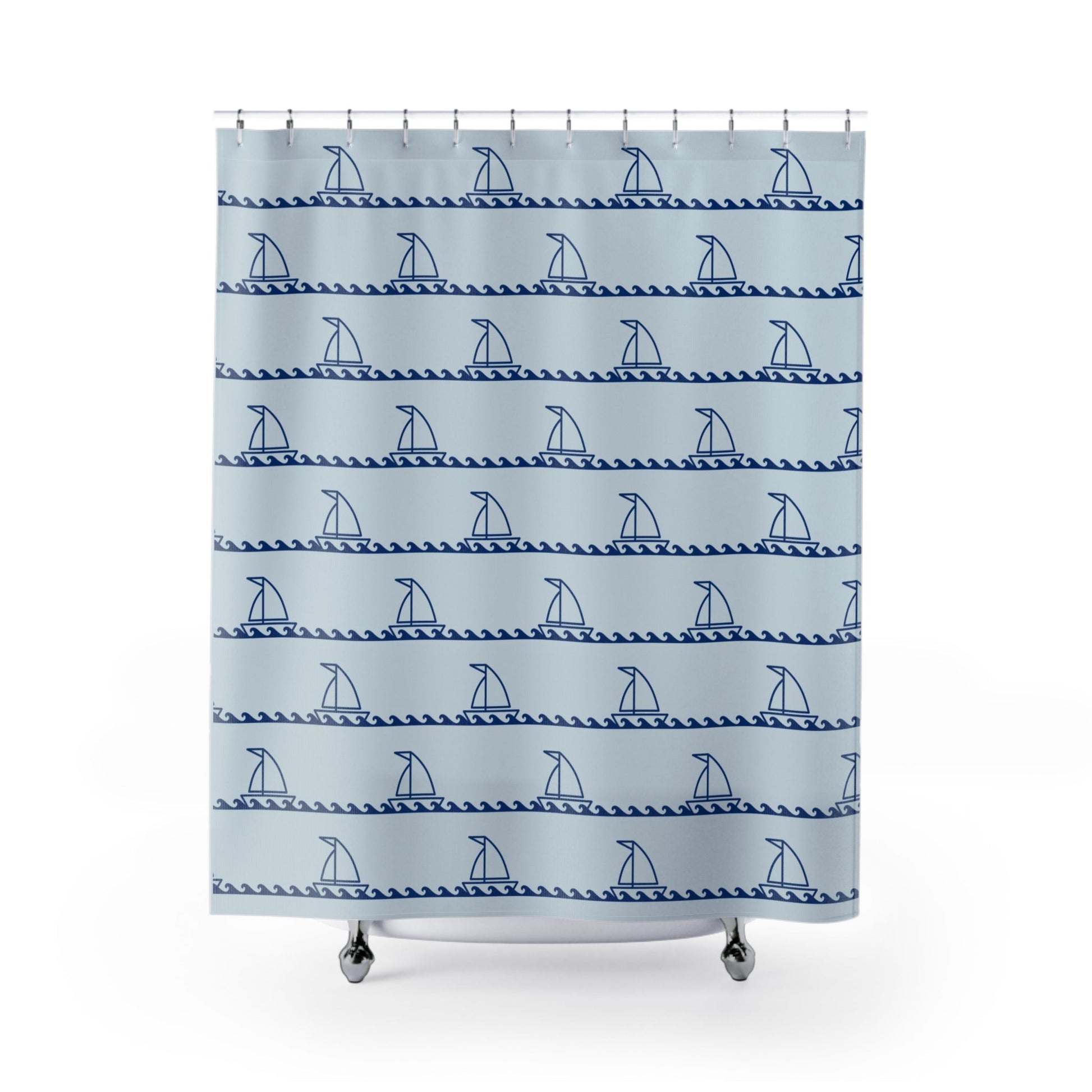 Shower curtain with blue sailboat pattern on a light blue background