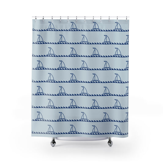 Shower curtain with blue sailboat pattern on a light blue background