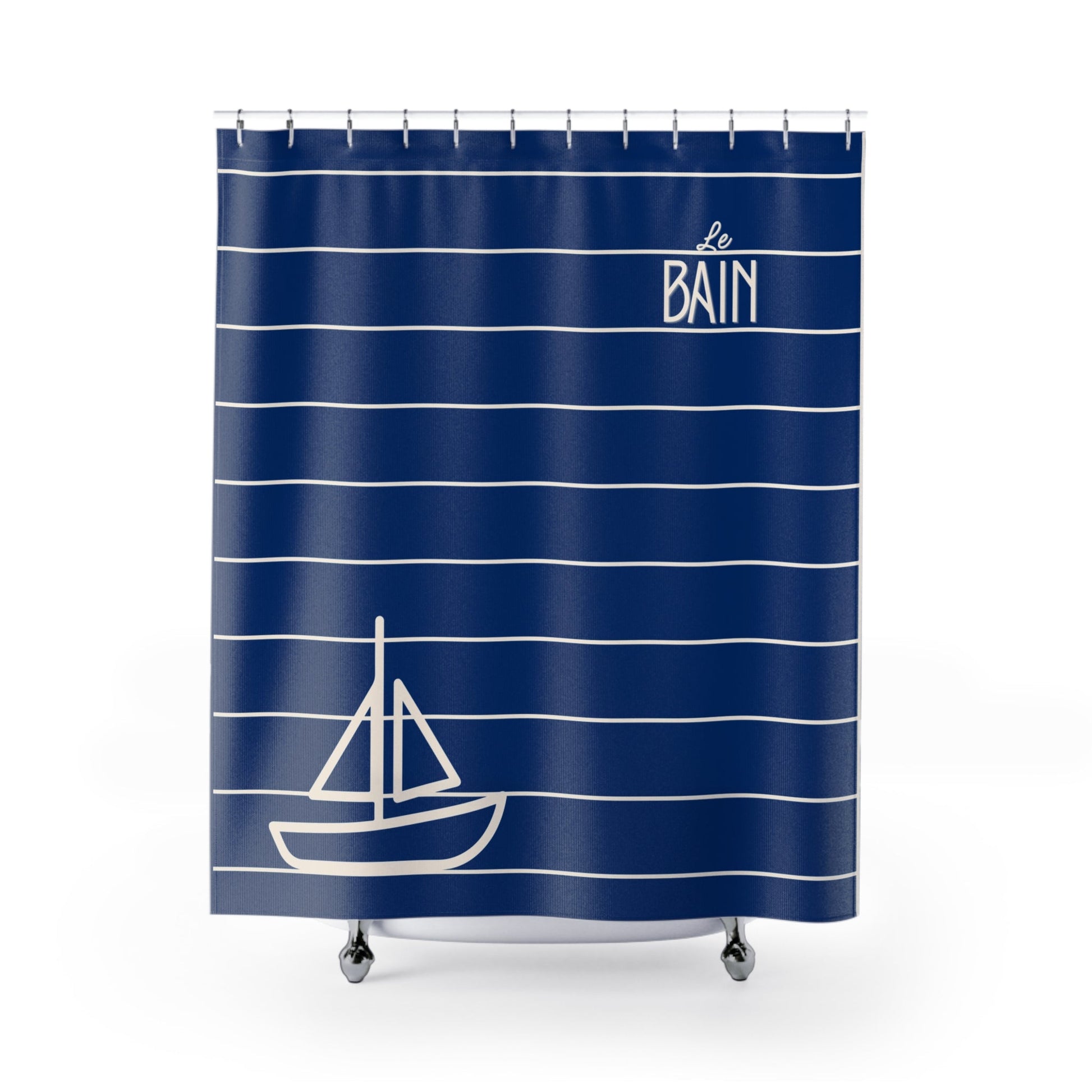 Navy blue shower curtain with white stripes and sailboat design, featuring 'Le Bain' text.