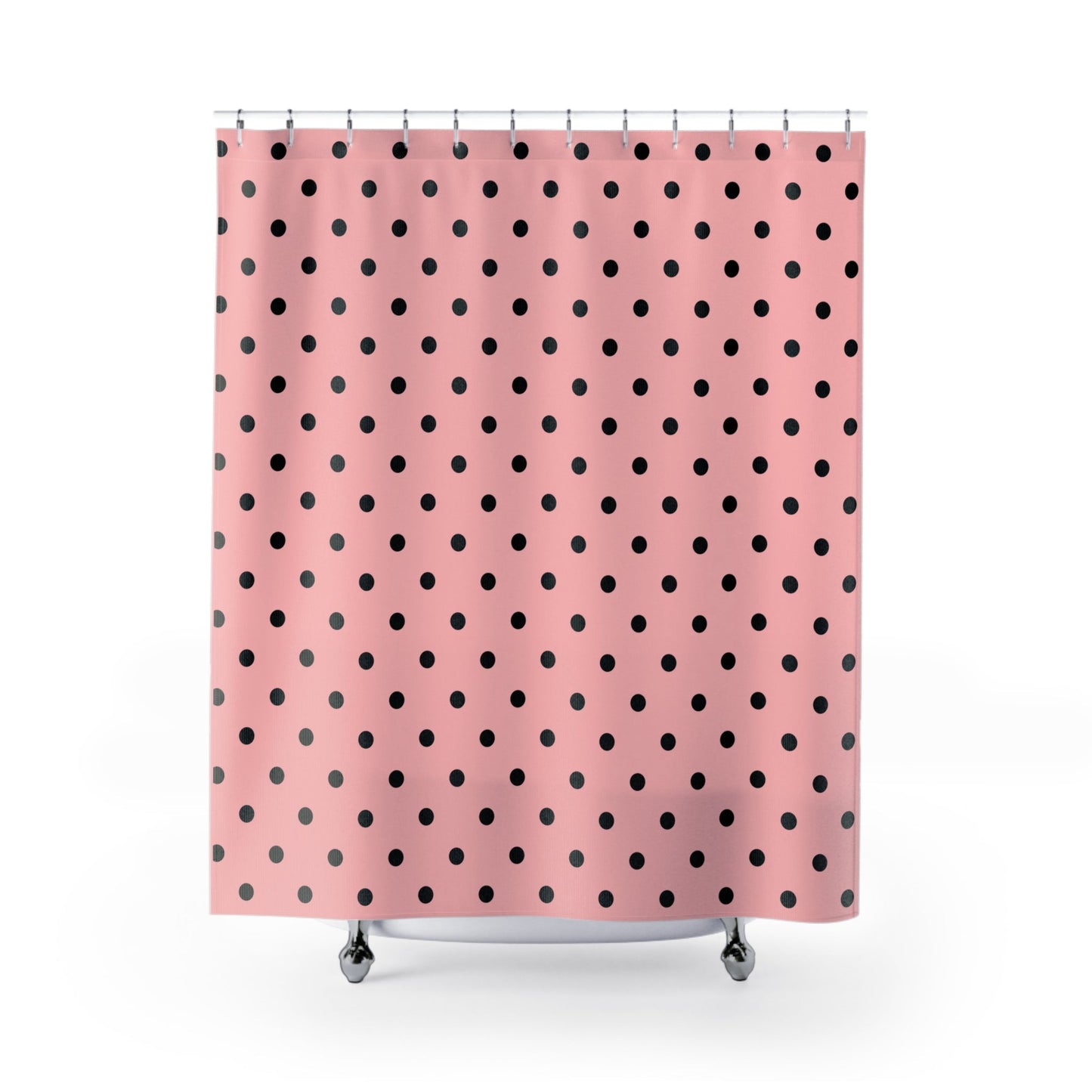Shower curtain with black polka dots on a pink background