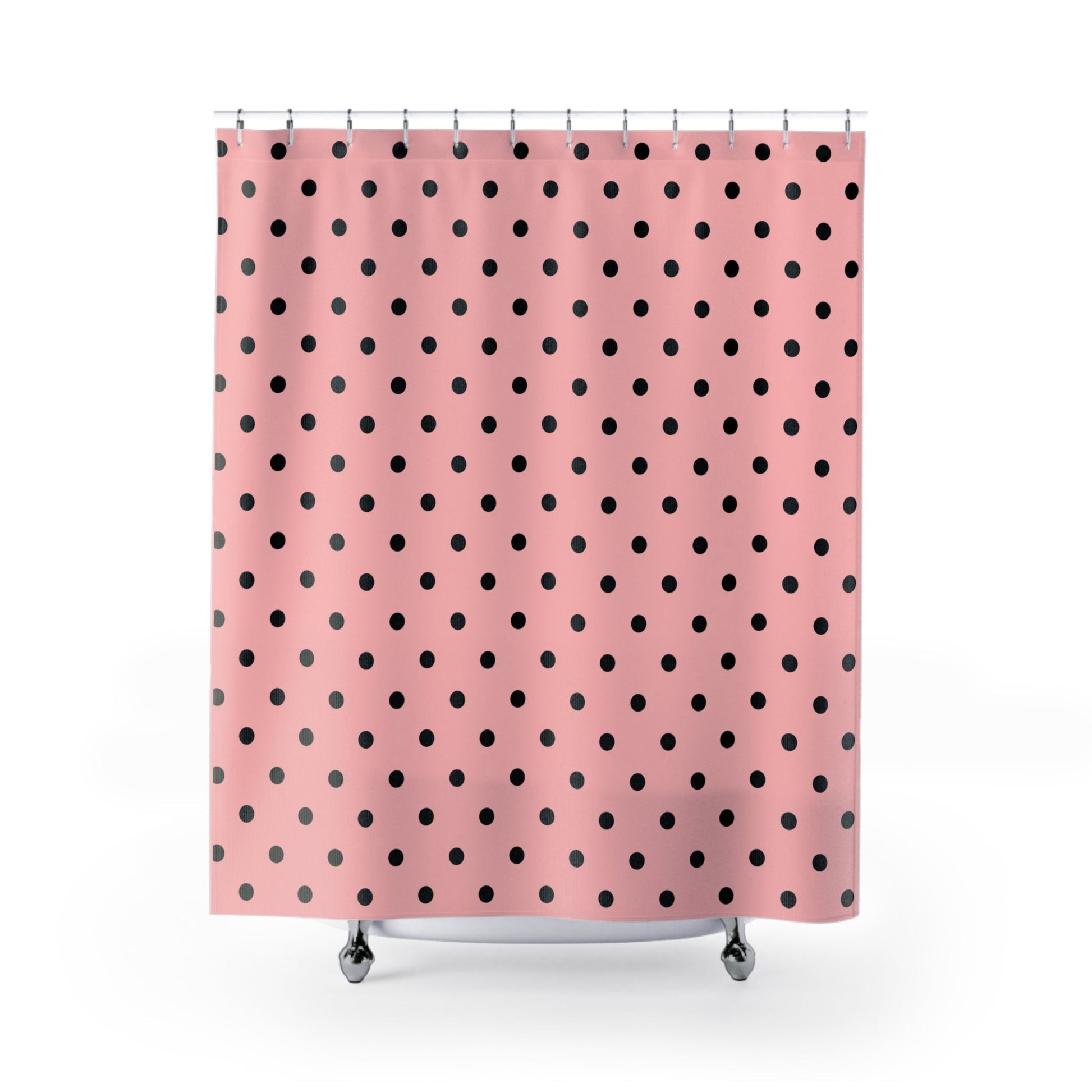 Shower curtain with black polka dots on a pink background