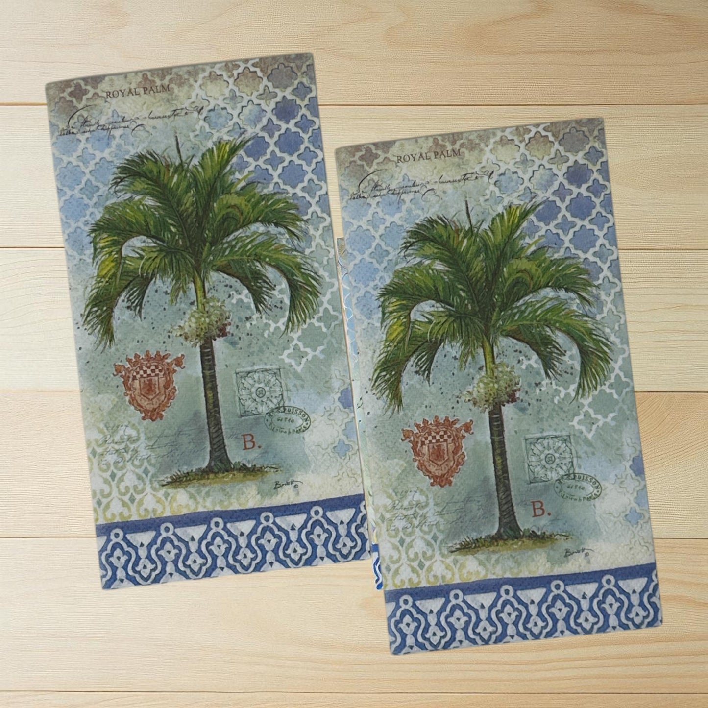 Royal palm cocktail size decoupage napkin with green tropical palm leaf design displayed unfolded