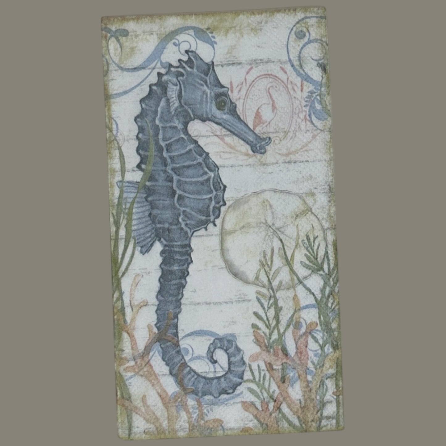 Seahorse cocktail size decoupage napkin with coastal nautical seahorse design displayed 