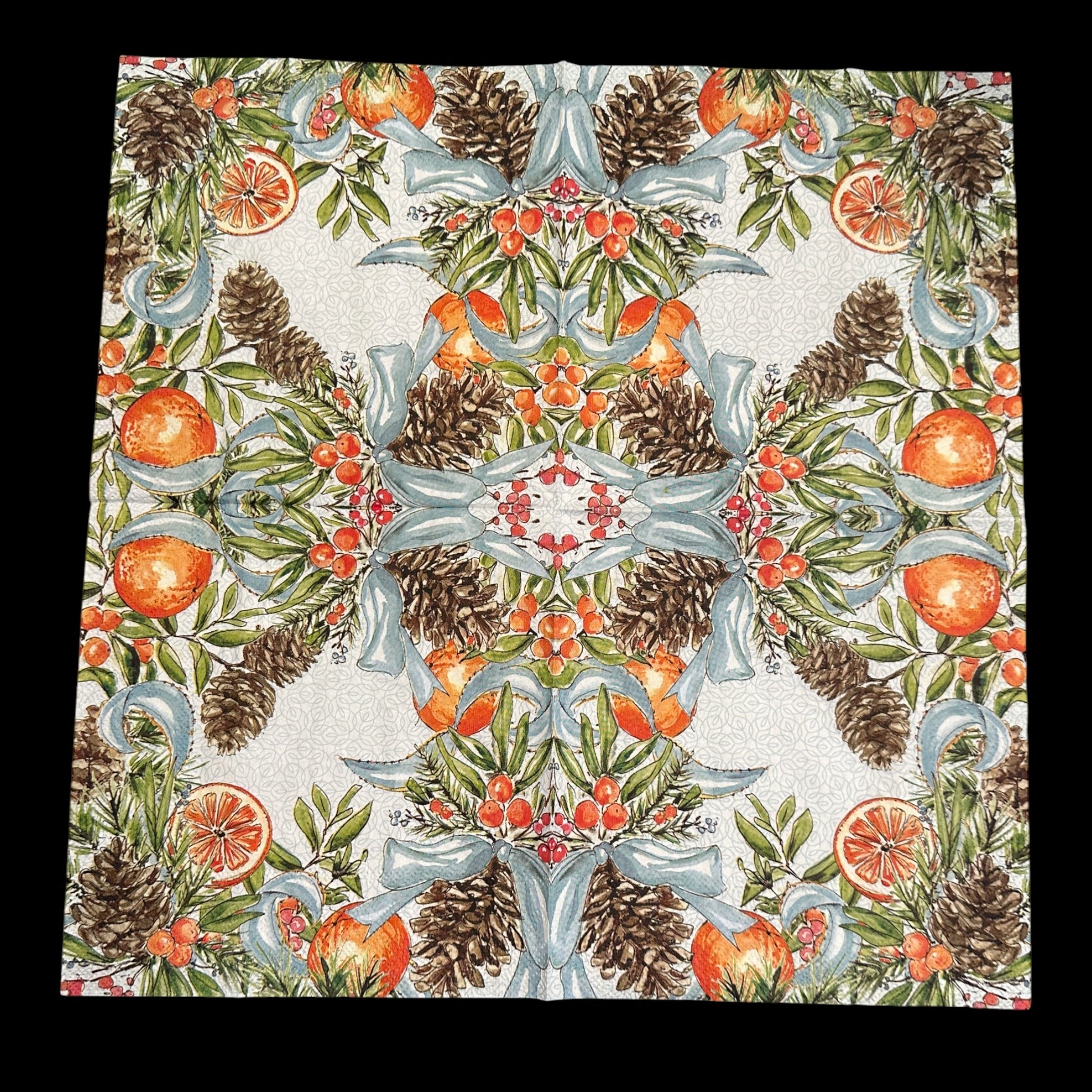 Unfolded Luncheon size decoupage napkin featuring pinecones, oranges, citrus slices, red berries, and blue ribbons on a white patterned background for holiday crafts.