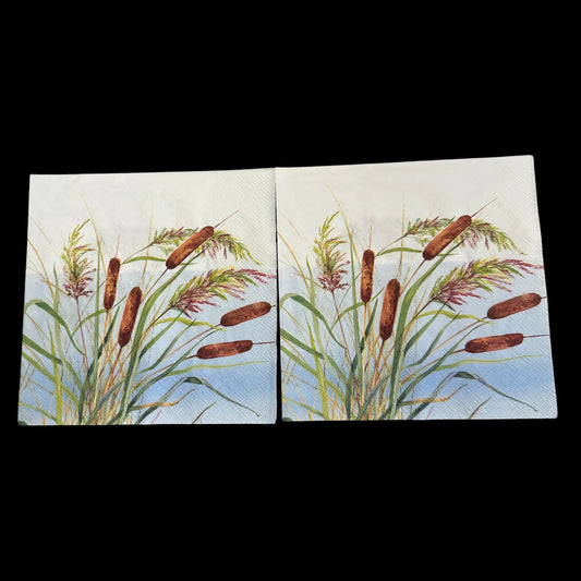 Two Luncheon size decoupage napkin featuring watercolor reeds and cattails in shades of green, brown, and purple on a blue sky background for nature crafts.