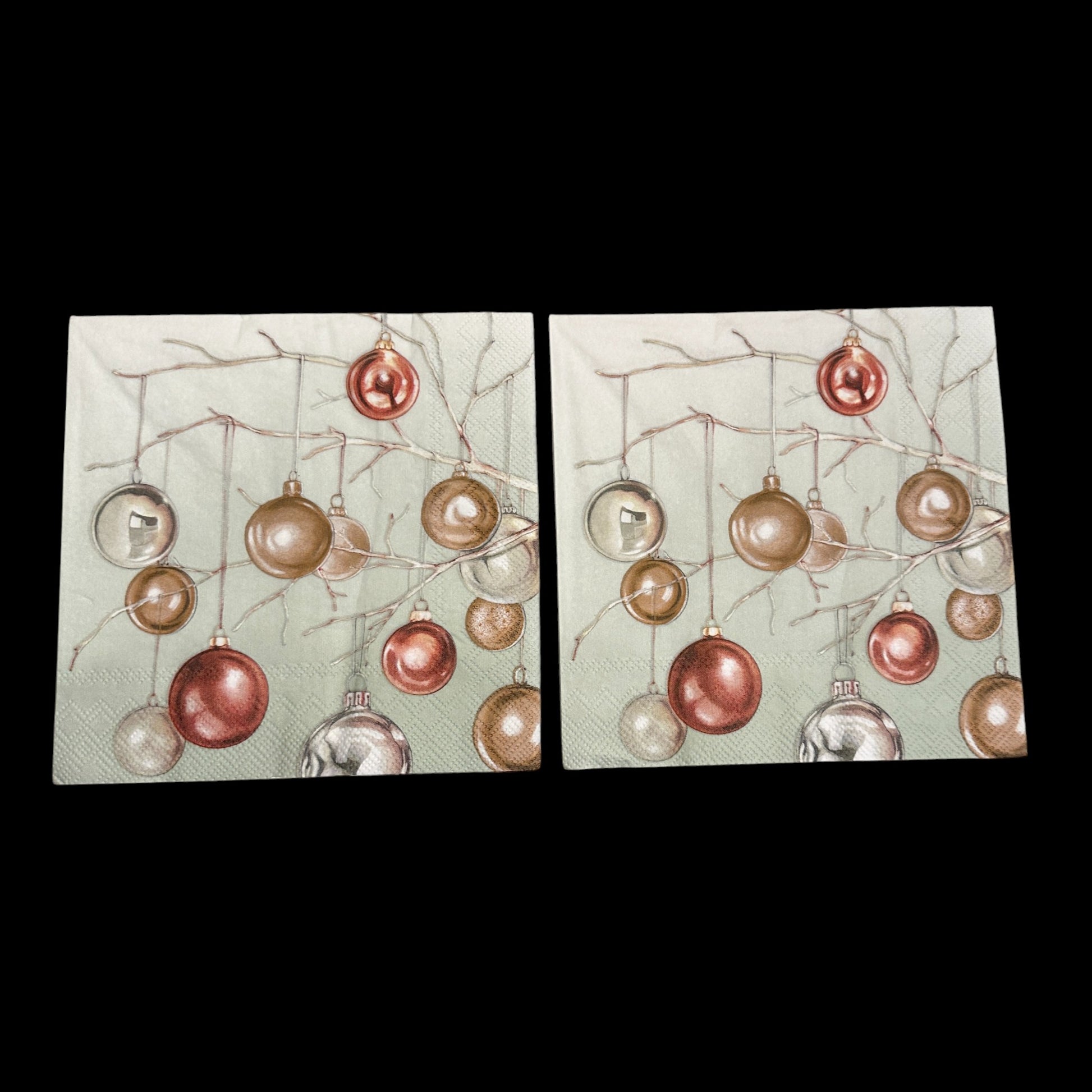 Two Luncheon size decoupage napkin featuring metallic copper and gold Christmas baubles hanging from branches on a soft green background for holiday crafts.