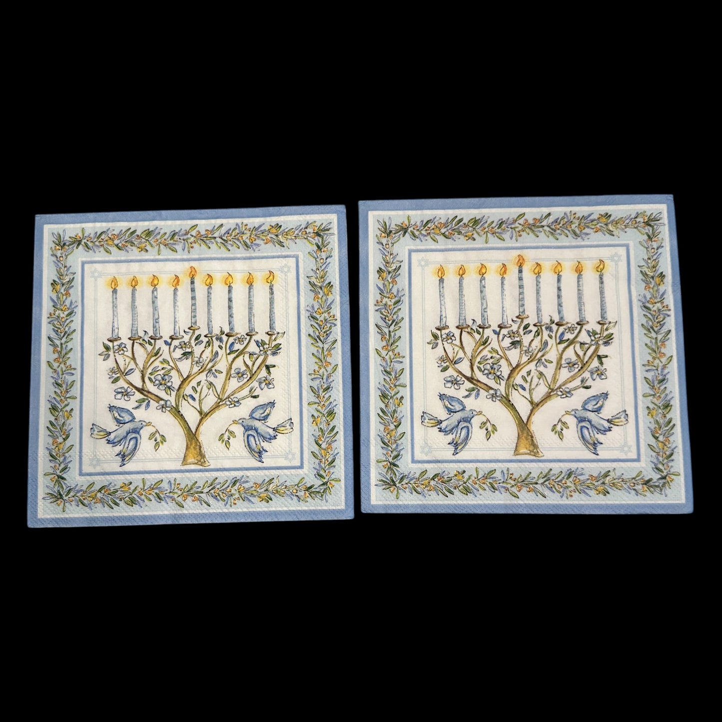 Two Luncheon size decoupage napkin featuring a menorah with blue candles, doves, and olive branches framed in blue and gold for Hanukkah crafts and décor.