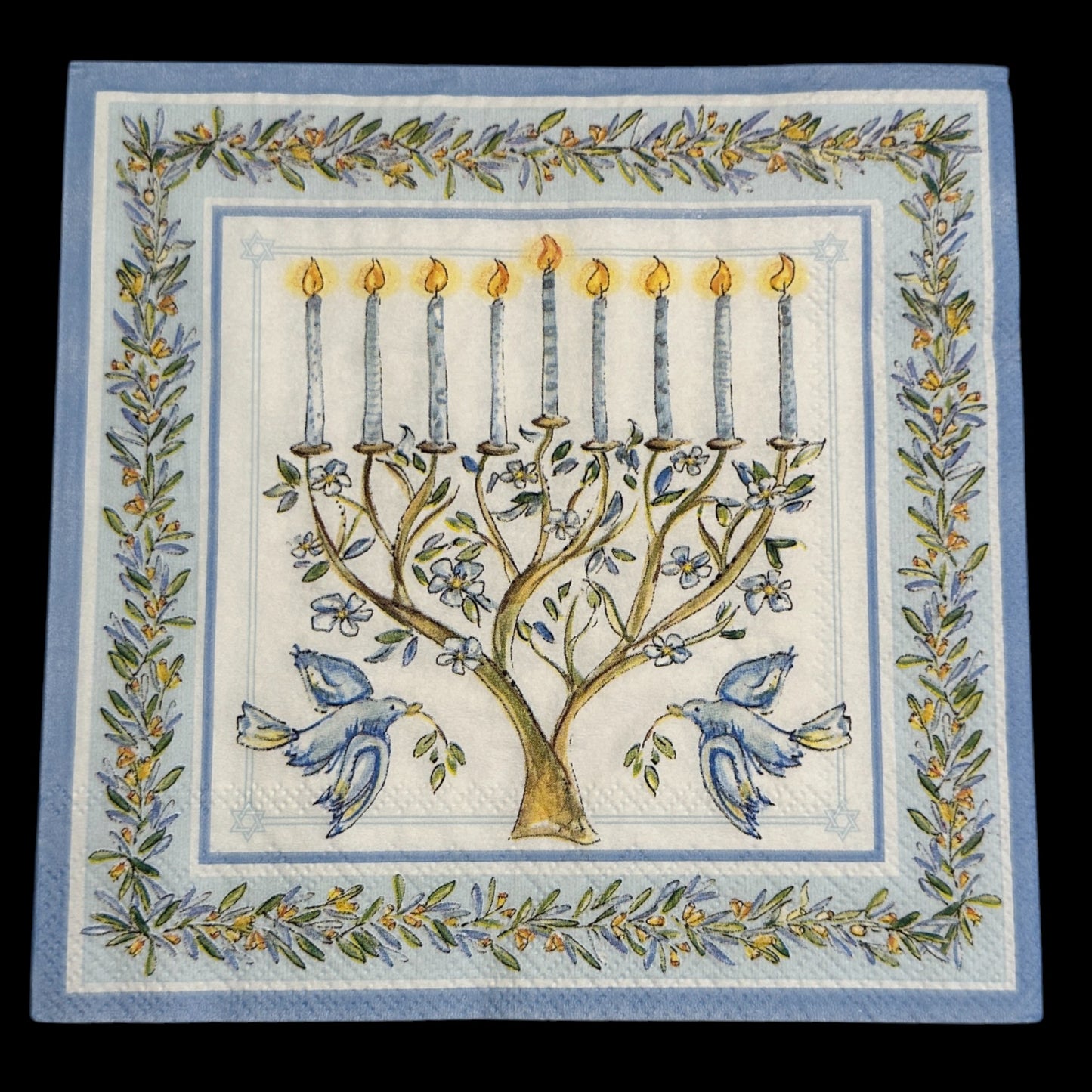 Luncheon size decoupage napkin featuring a menorah with blue candles, doves, and olive branches framed in blue and gold for Hanukkah crafts and décor.