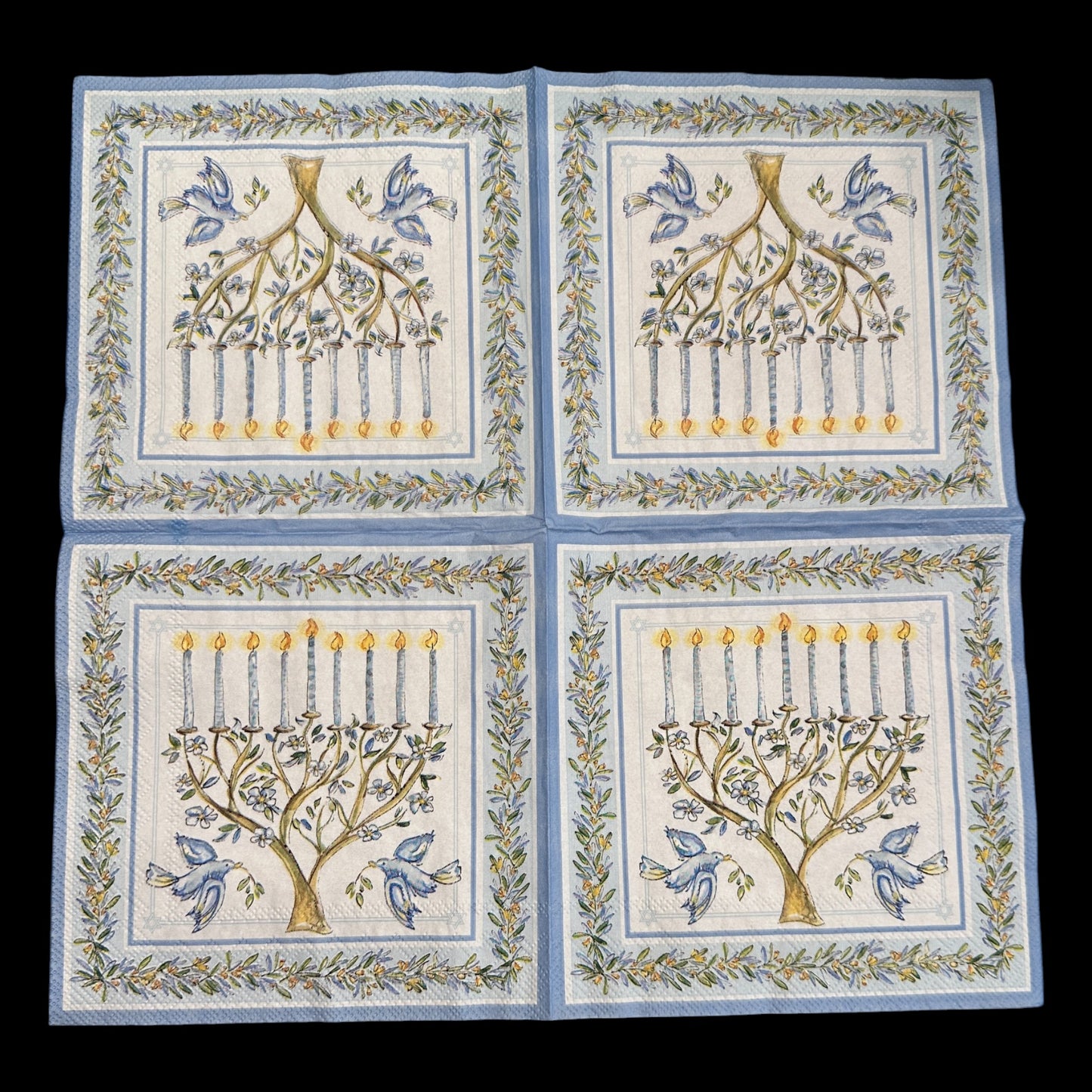Unfolded Luncheon size decoupage napkin featuring a menorah with blue candles, doves, and olive branches framed in blue and gold for Hanukkah crafts and décor.