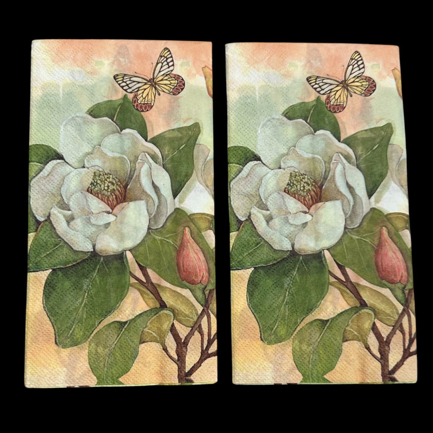 Two Guest size decoupage napkin featuring white magnolia flowers, green leaves, and a butterfly on a soft background, ideal for floral crafts and spring decor.