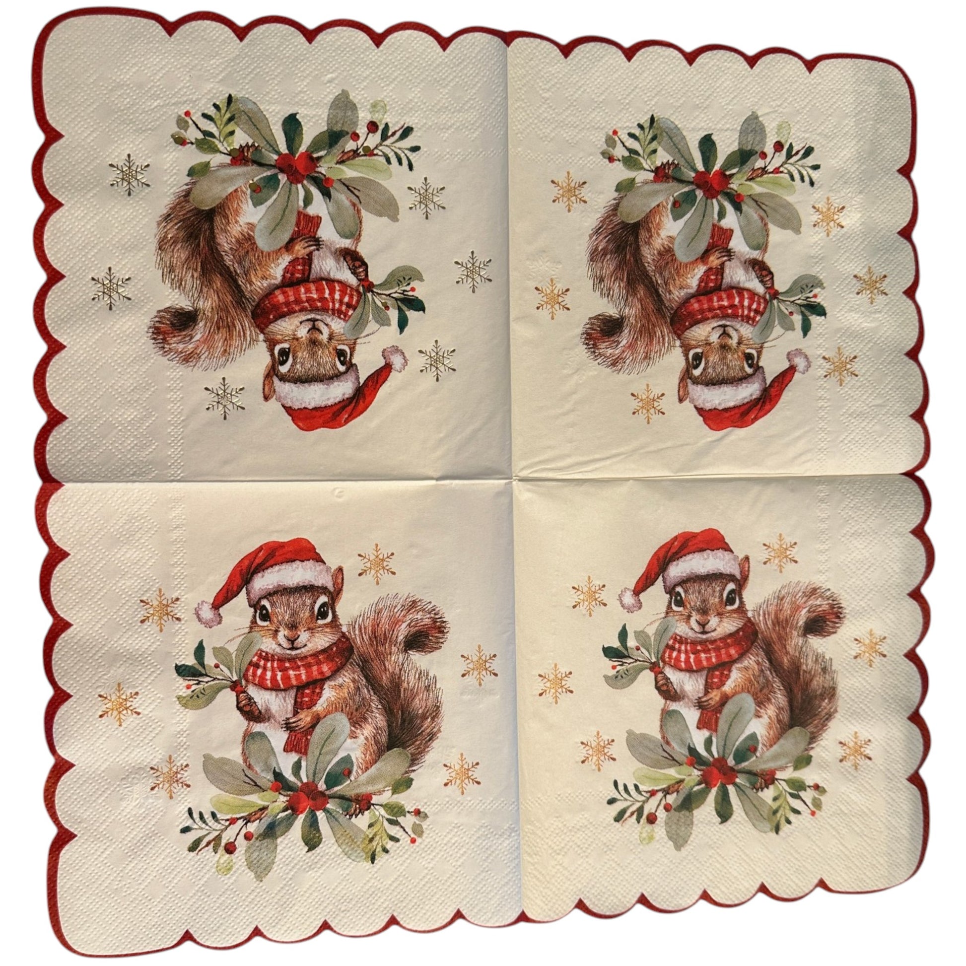 A set of four square paper napkins with scalloped edges, featuring a vintage-style illustration of a squirrel wearing a red Santa hat and scarf, surrounded by green holly leaves and gold stars, with a red border.