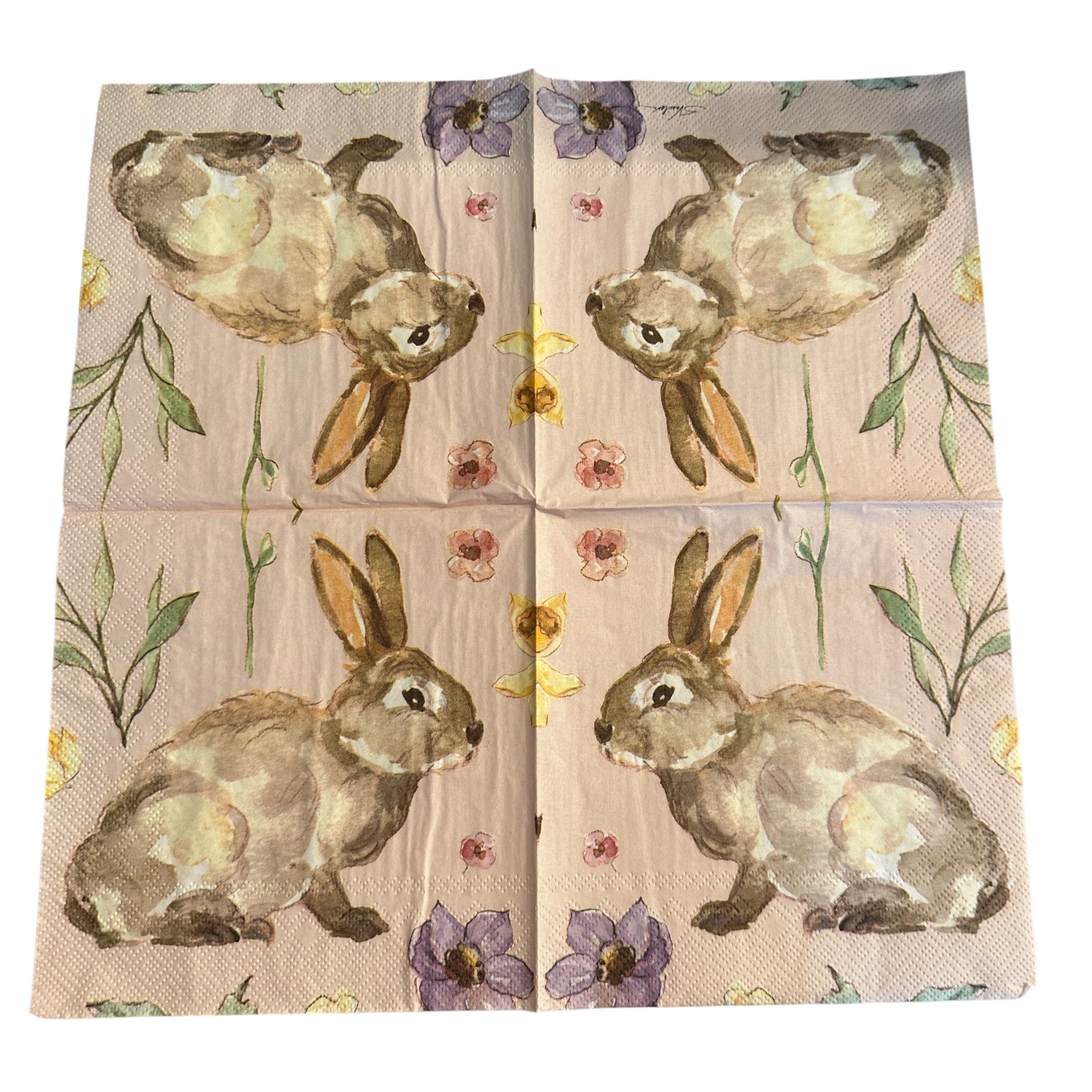 Luncheon size decoupage napkin featuring a watercolor garden bunny surrounded by wildflowers in blush pink lavender and butter yellow on a soft pink background set of 2
