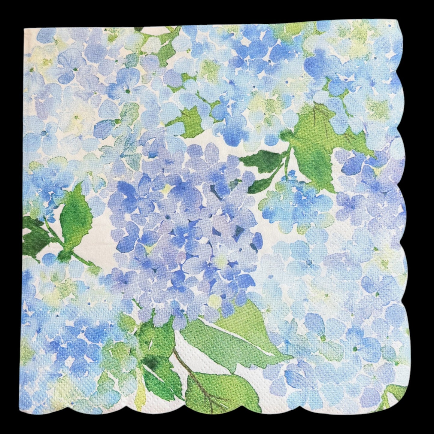 Two luncheon size decoupage paper napkins with scalloped edges featuring lush watercolor hydrangea clusters in periwinkle blue cornflower and violet with rich green leaves on a creamy white background set of 2