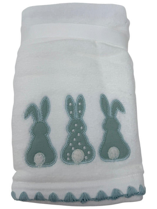 Set of two white hand towels featuring blue applique bunnies with white cotton tails and scalloped border by Caro Home