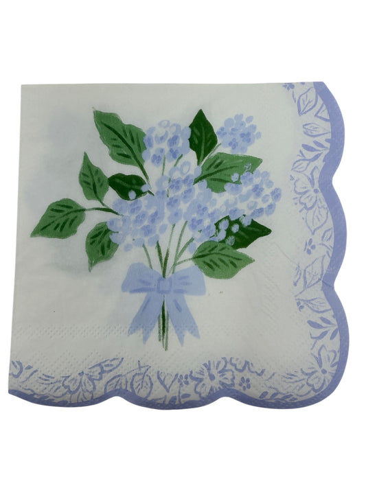 Blue hydrangea scallop edge cocktail napkin with light blue flowers, leafy greens, and floral border