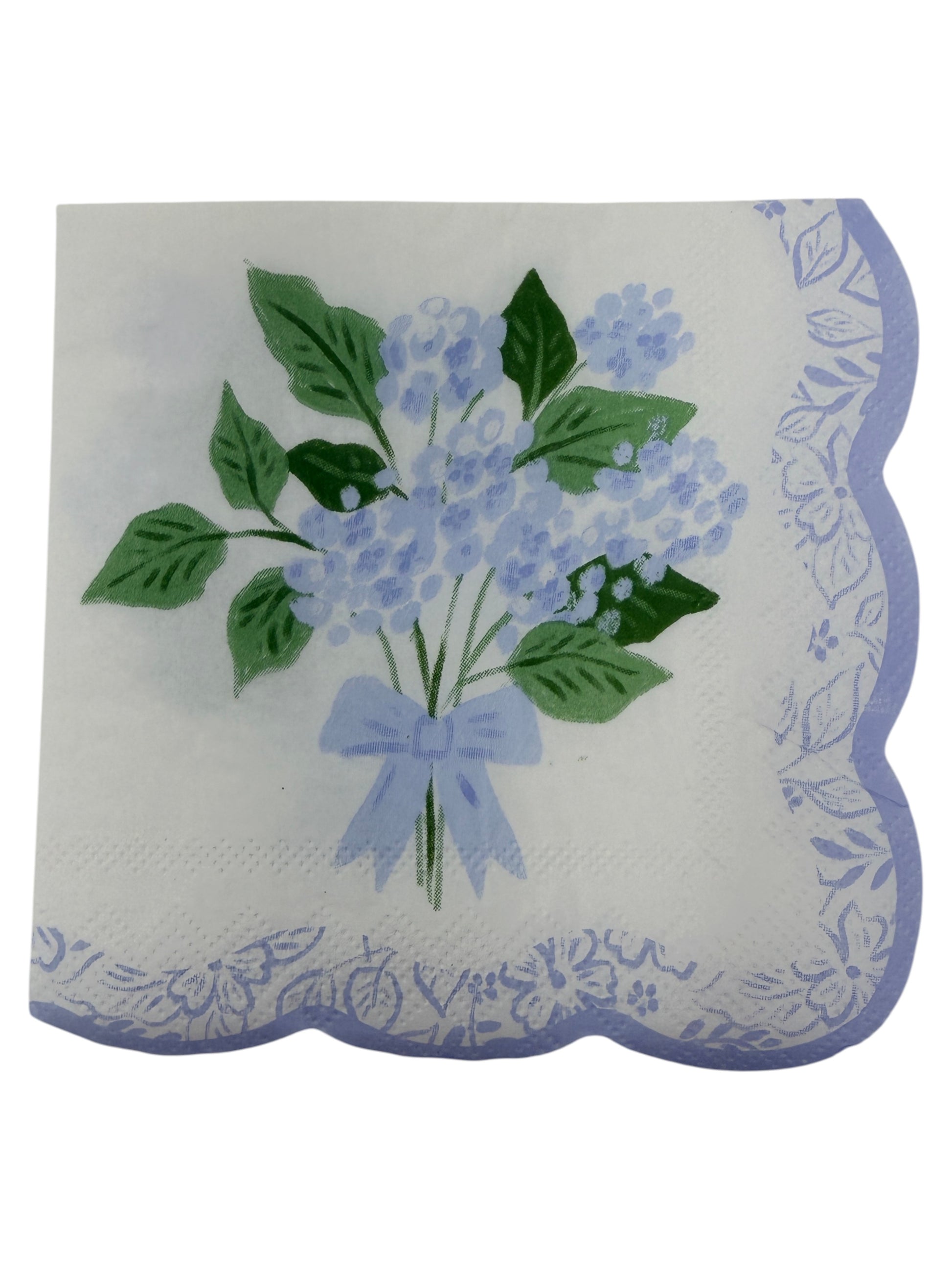 Blue hydrangea scallop edge cocktail napkin with light blue flowers, leafy greens, and floral border