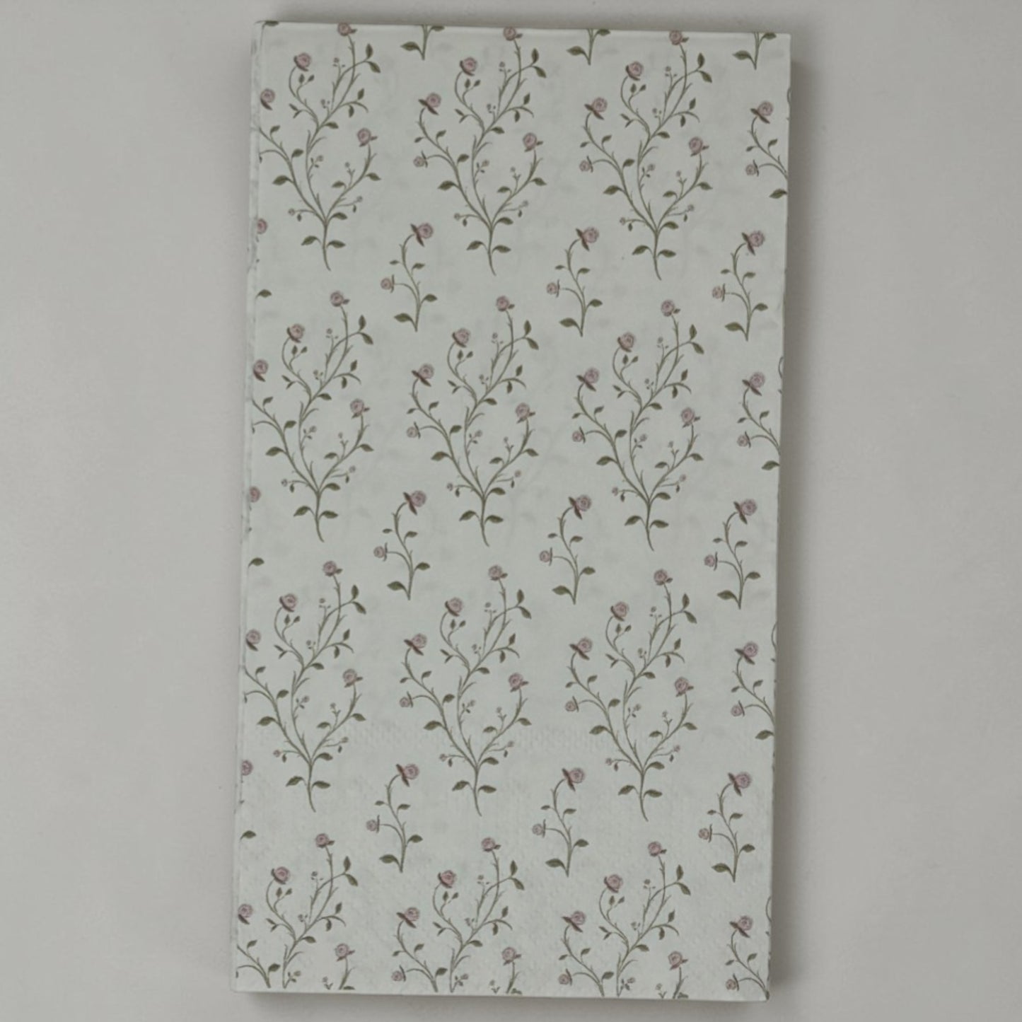 Guest size decoupage napkins featuring delicate trailing rose vine cascades with tiny blush pink rosebuds and soft olive gold leaves on a warm creamy ivory background set of 2