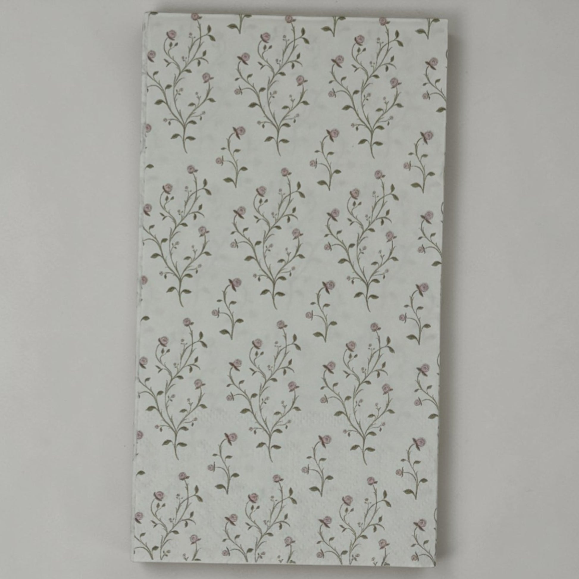 Guest size decoupage napkins featuring delicate trailing rose vine cascades with tiny blush pink rosebuds and soft olive gold leaves on a warm creamy ivory background set of 2