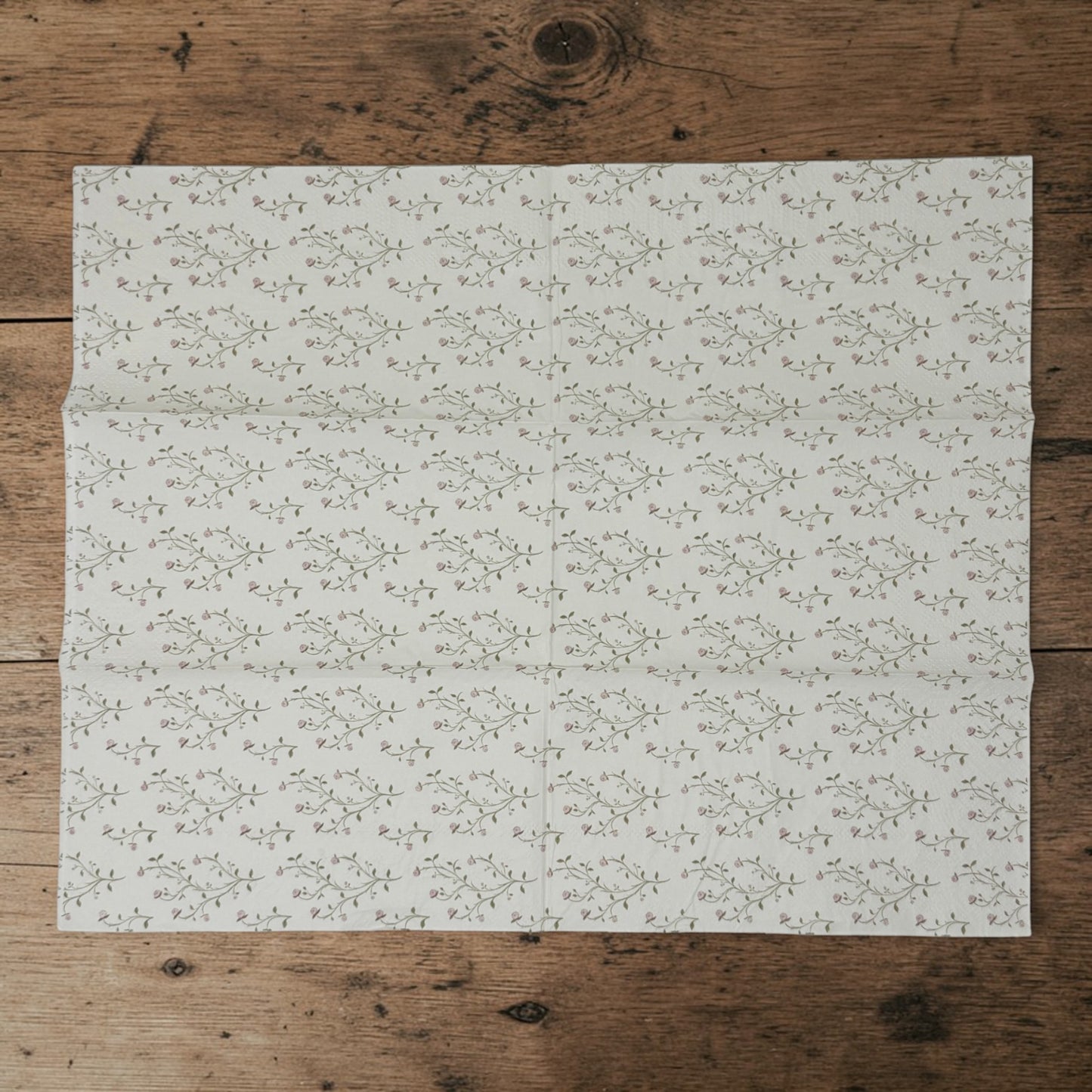 Guest size decoupage napkins featuring delicate trailing rose vine cascades with tiny blush pink rosebuds and soft olive gold leaves on a warm creamy ivory background set of 2