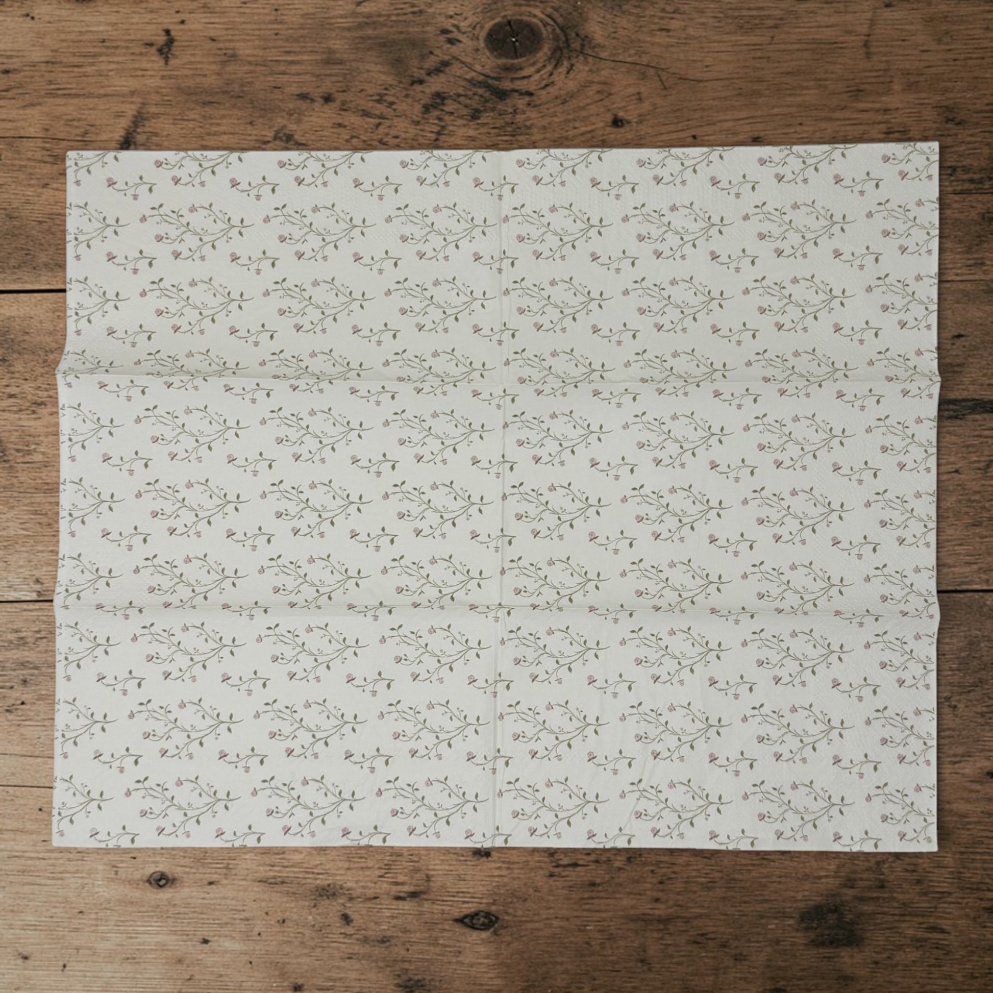 Guest size decoupage napkins featuring delicate trailing rose vine cascades with tiny blush pink rosebuds and soft olive gold leaves on a warm creamy ivory background set of 2