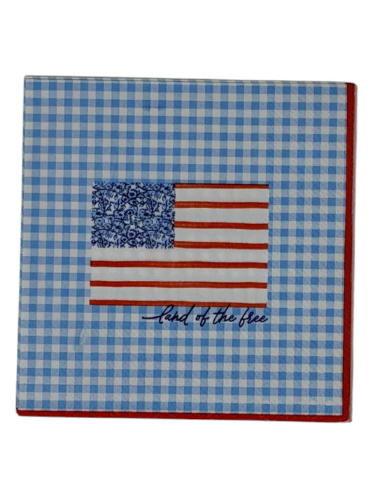 Cocktail size decoupage paper napkin featuring a stylized American flag with a blue floral botanical canton and red stripes above Land of the free cursive script on a fresh sky blue gingham background with a red border set of 2