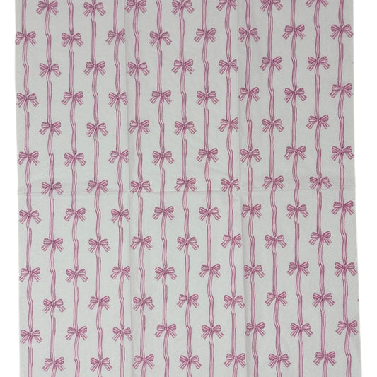 Two guest-size decoupage paper napkins featuring an all-over print of vertical wavy stripes with small striped bows tied at intervals in dusty pink and mauve on a crisp white background, photographed on a white surface.