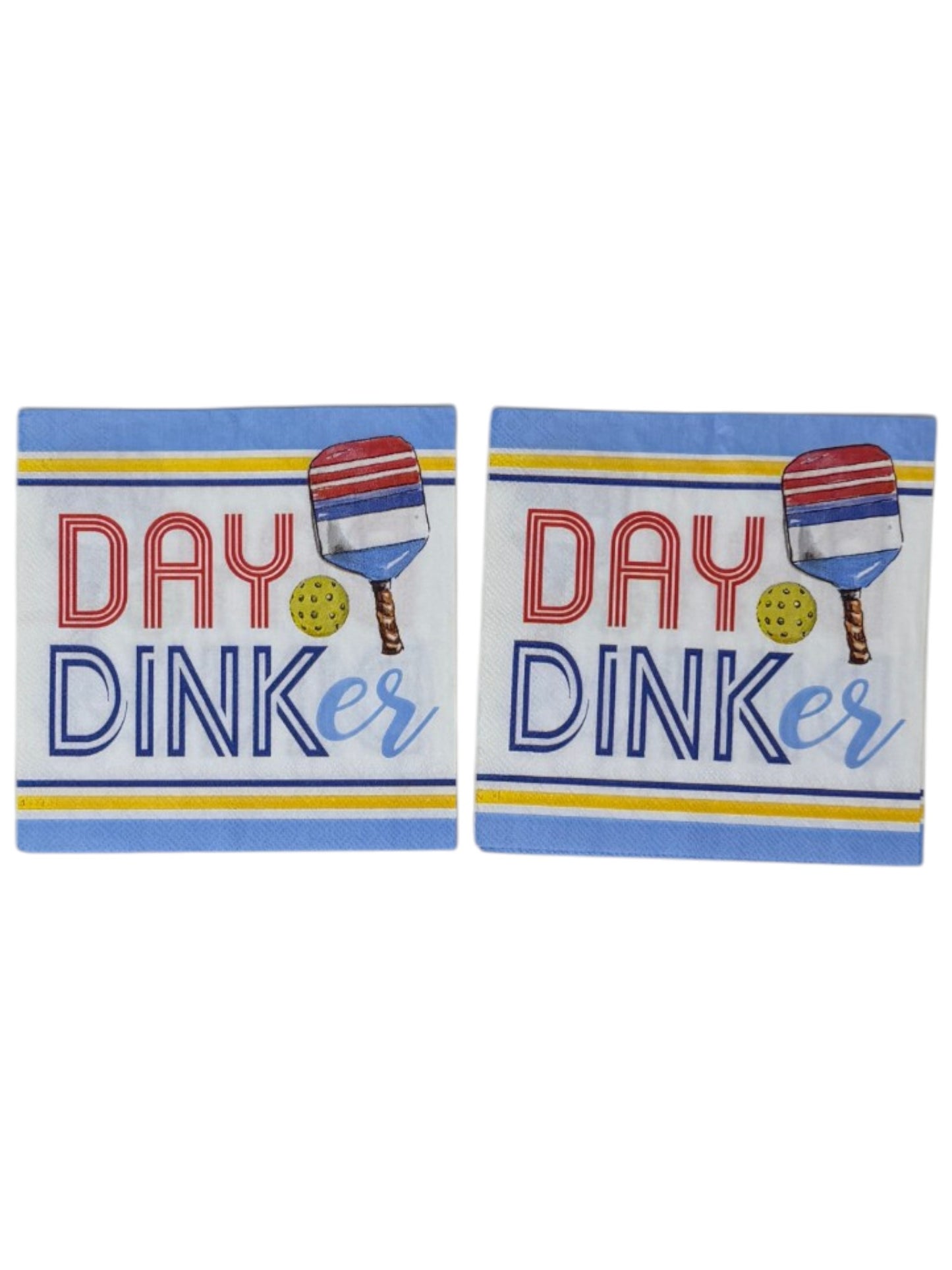 Two 'Day Dinker napkins with paddle ball design on a white background