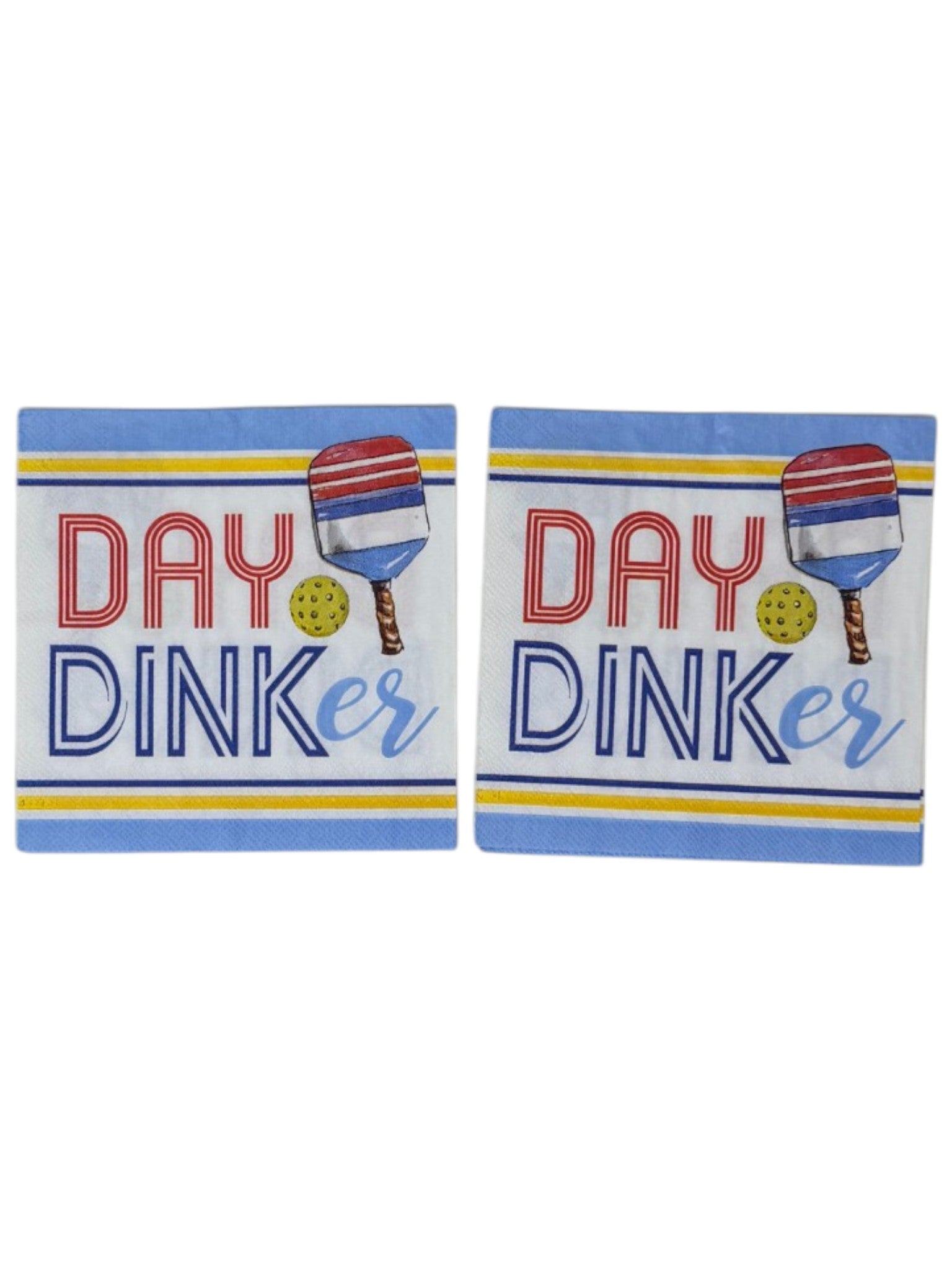 Two 'Day Dinker napkins with paddle ball design on a white background
