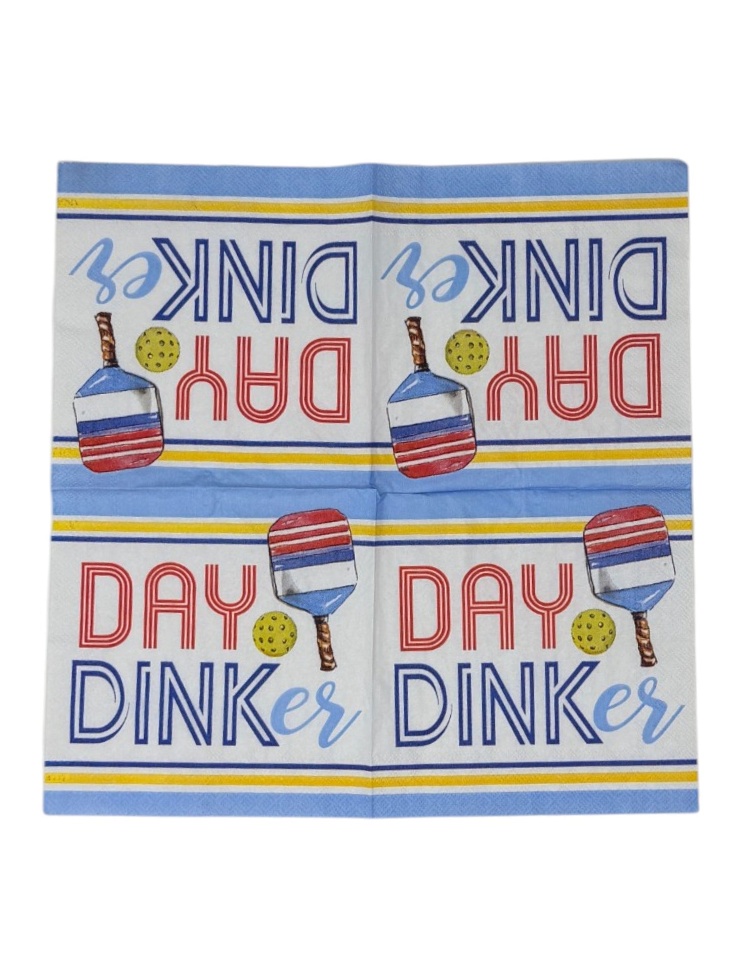 Unfolded paper napkin with 'Dink Day Dinker' text and paddle graphics on a blue background
