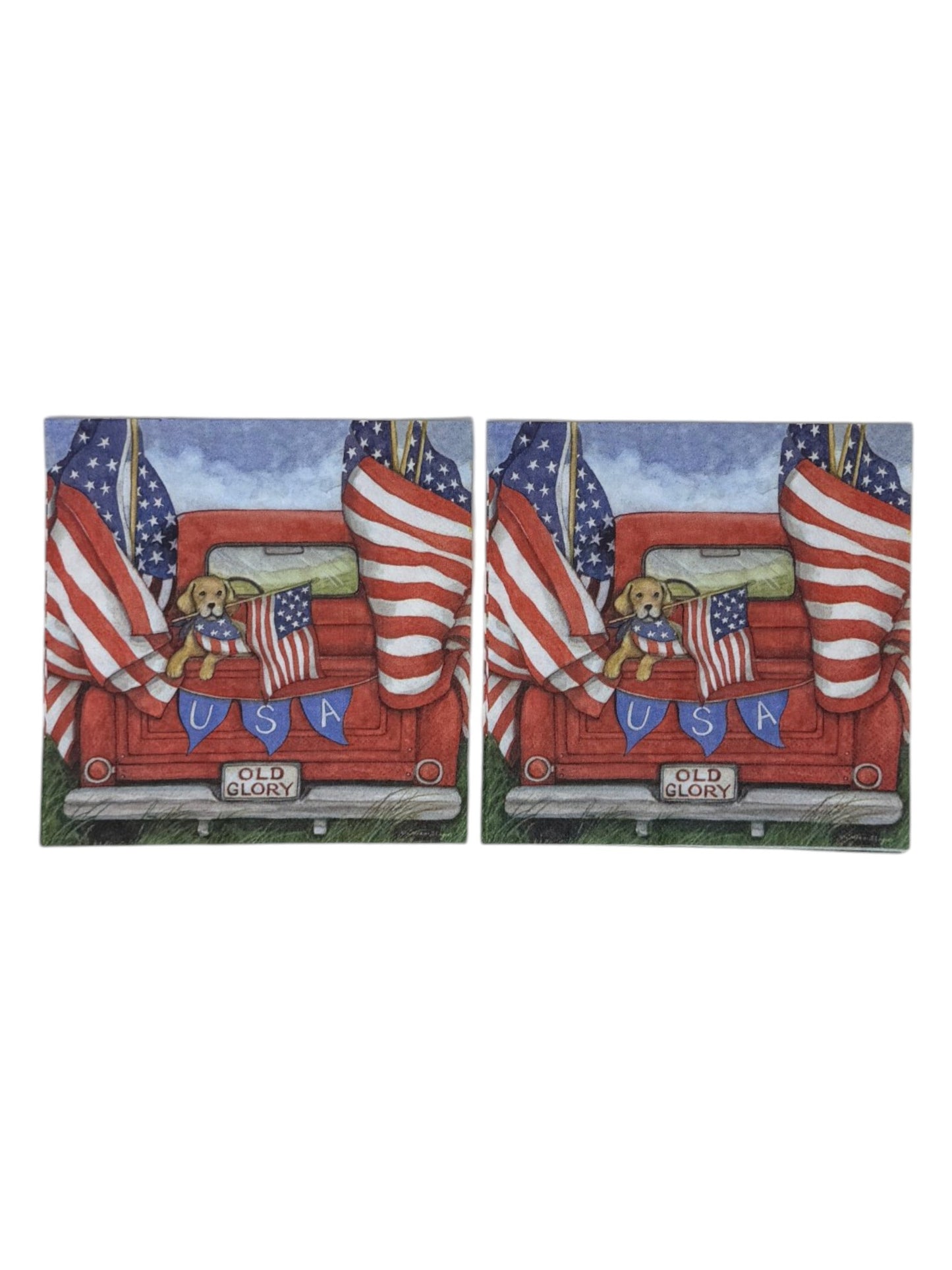 Luncheon size decoupage paper napkin featuring a golden retriever in a flag bandana peeking over the tailgate of a classic red pickup truck flying large American flags with a USA bunting banner and Old Glory license plate set of 2