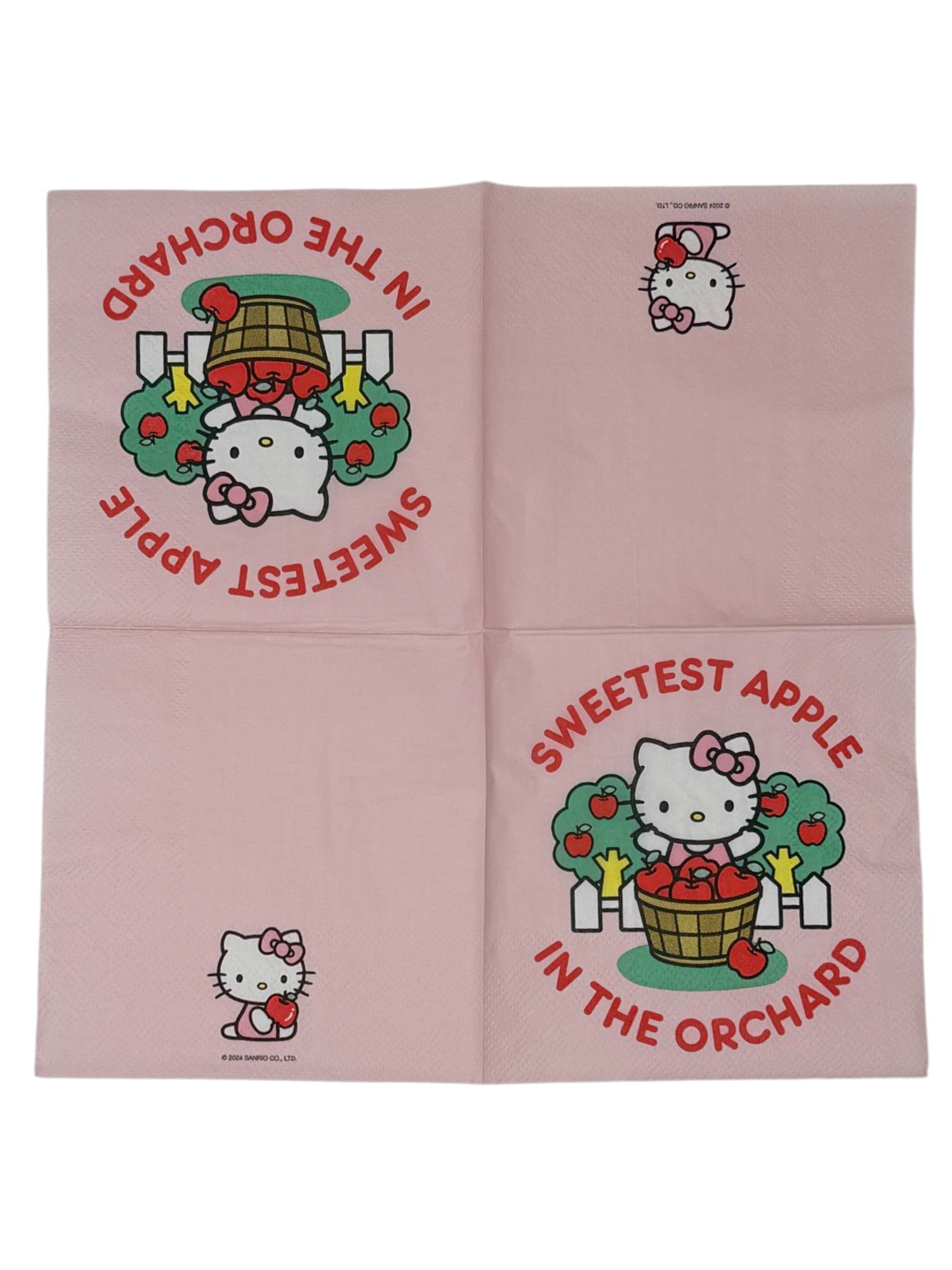 Cocktail-size decoupage paper napkin featuring Hello Kitty standing behind a wooden barrel of red apples with green apple trees and a white picket fence, surrounded by the phrase Sweetest Apple in the Orchard in bold red lettering on a soft blush pink background.